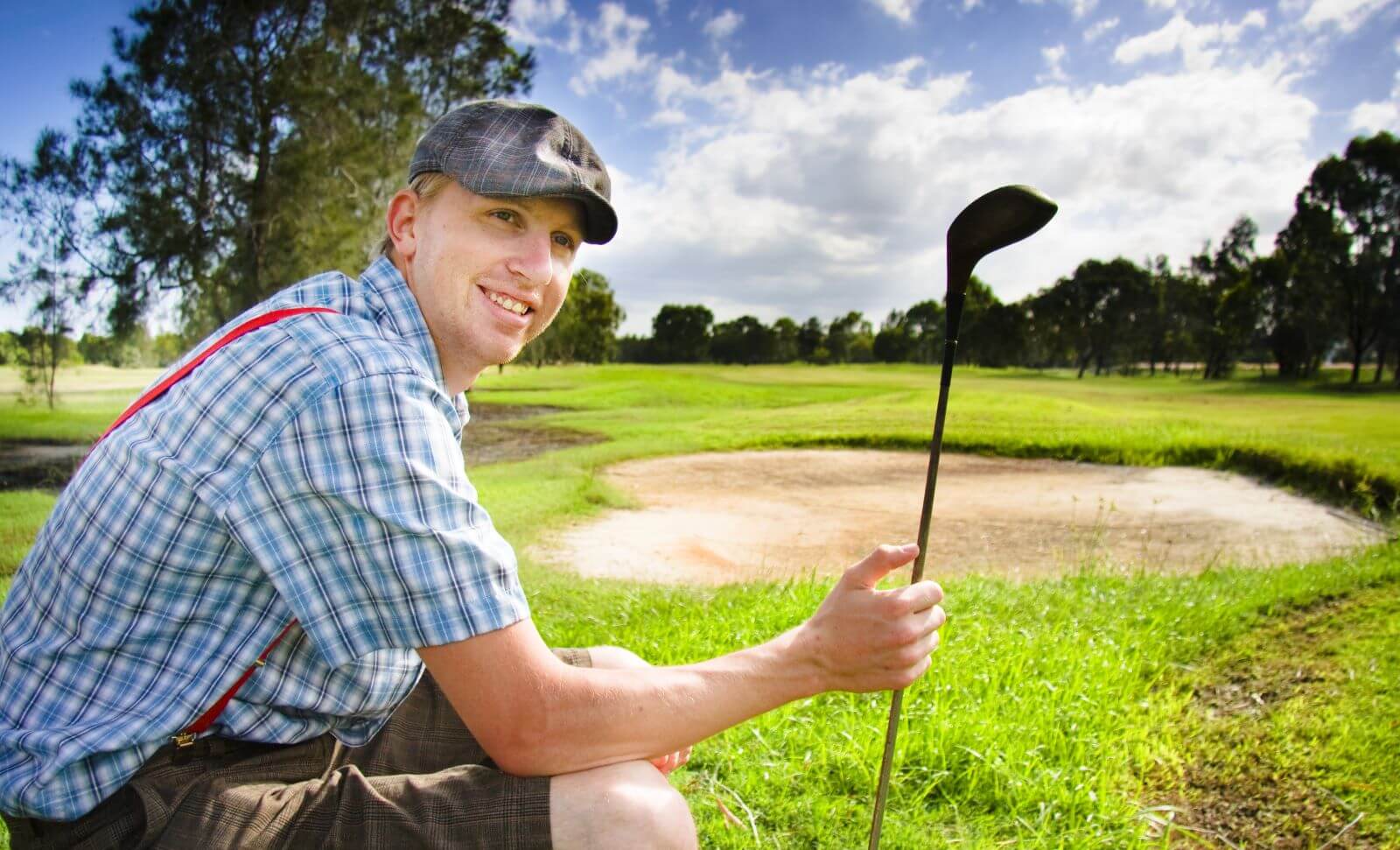 Sitting golfer at golf course