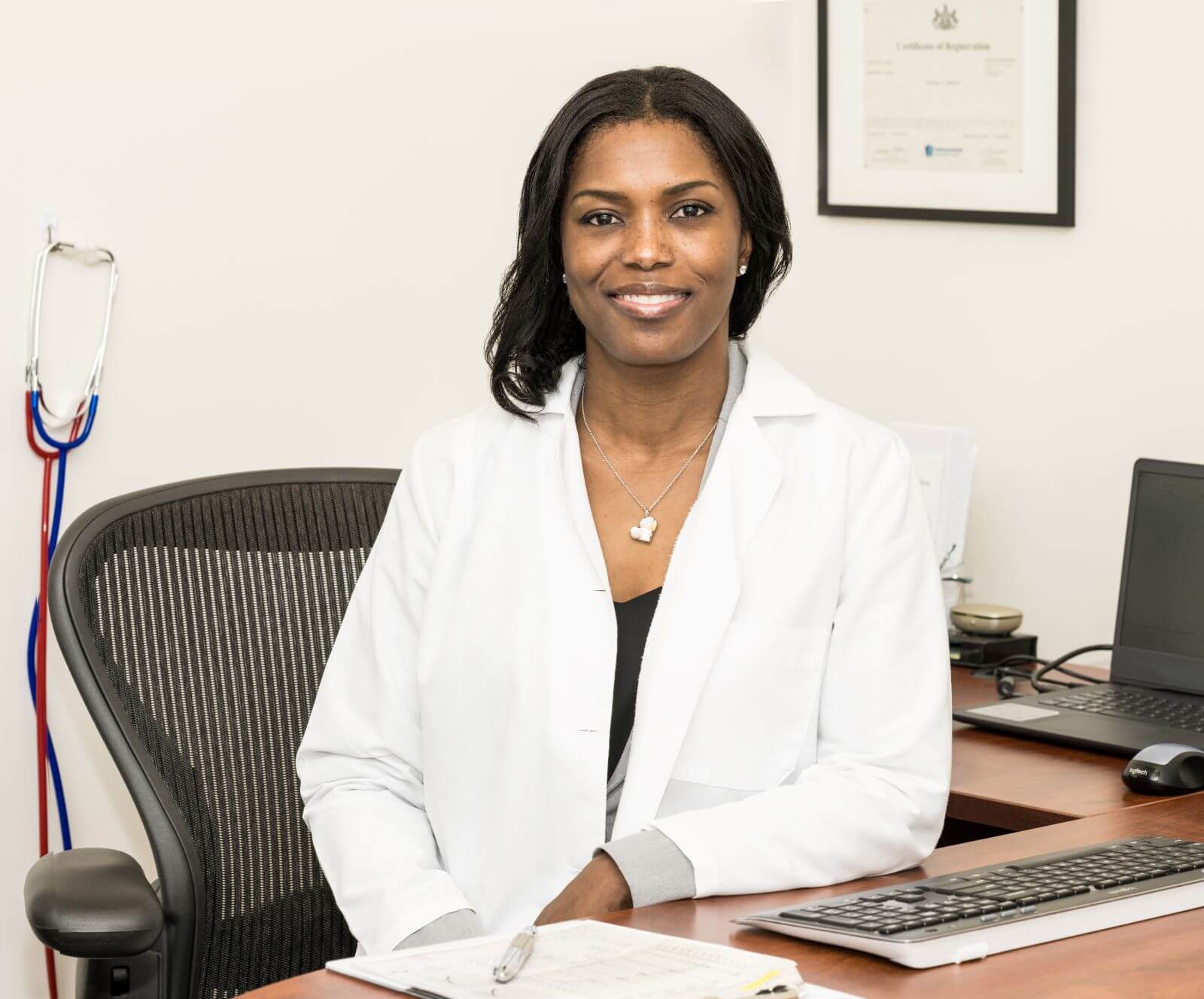 Kivoney Mehrer at a desk in Fairway Hearing Center